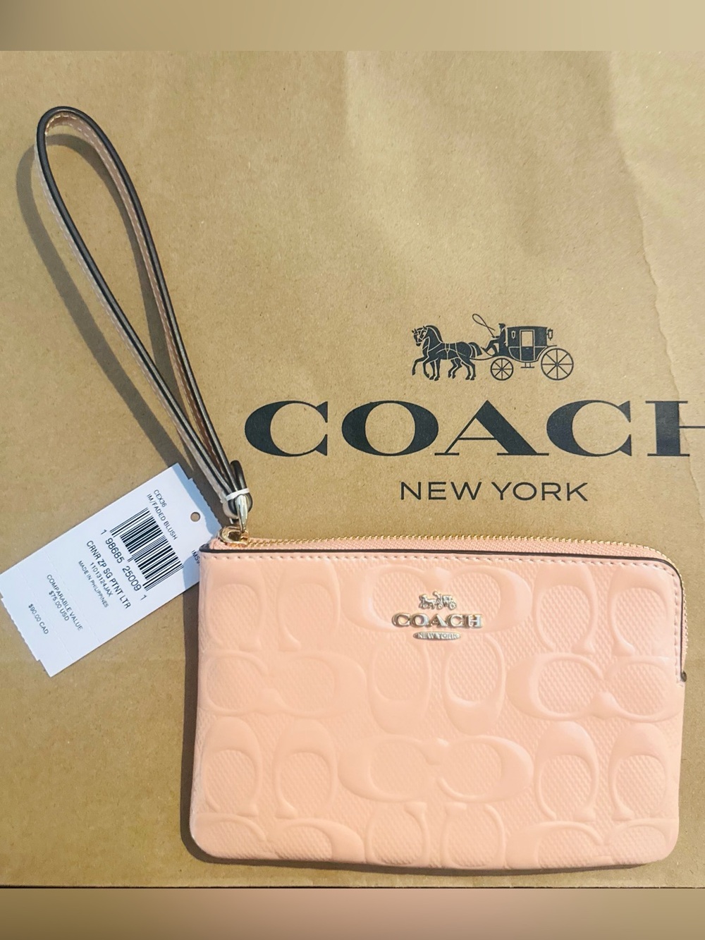 Coach Pastel Pink Wristlet with Gold Logo
